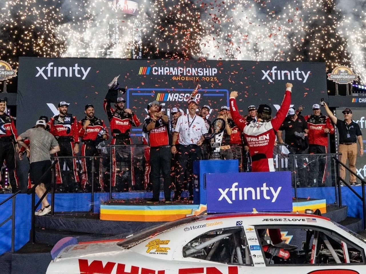 Jesse Love celebrates the 2025 NASCAR Xfinity Series championship at Phoenix