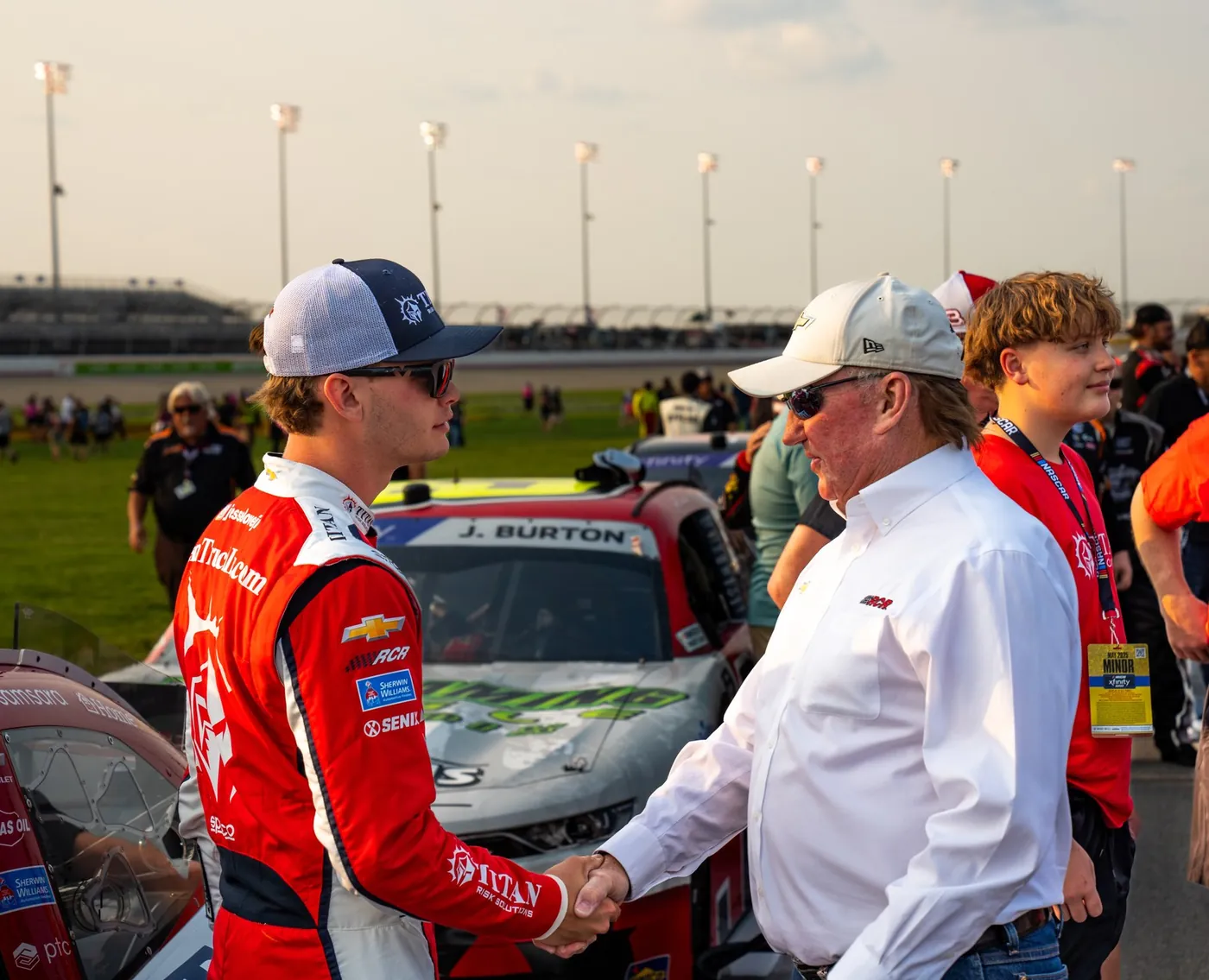 Jesse Love shakes hands with NASCAR Hall of Famer Richard Childress on the grid