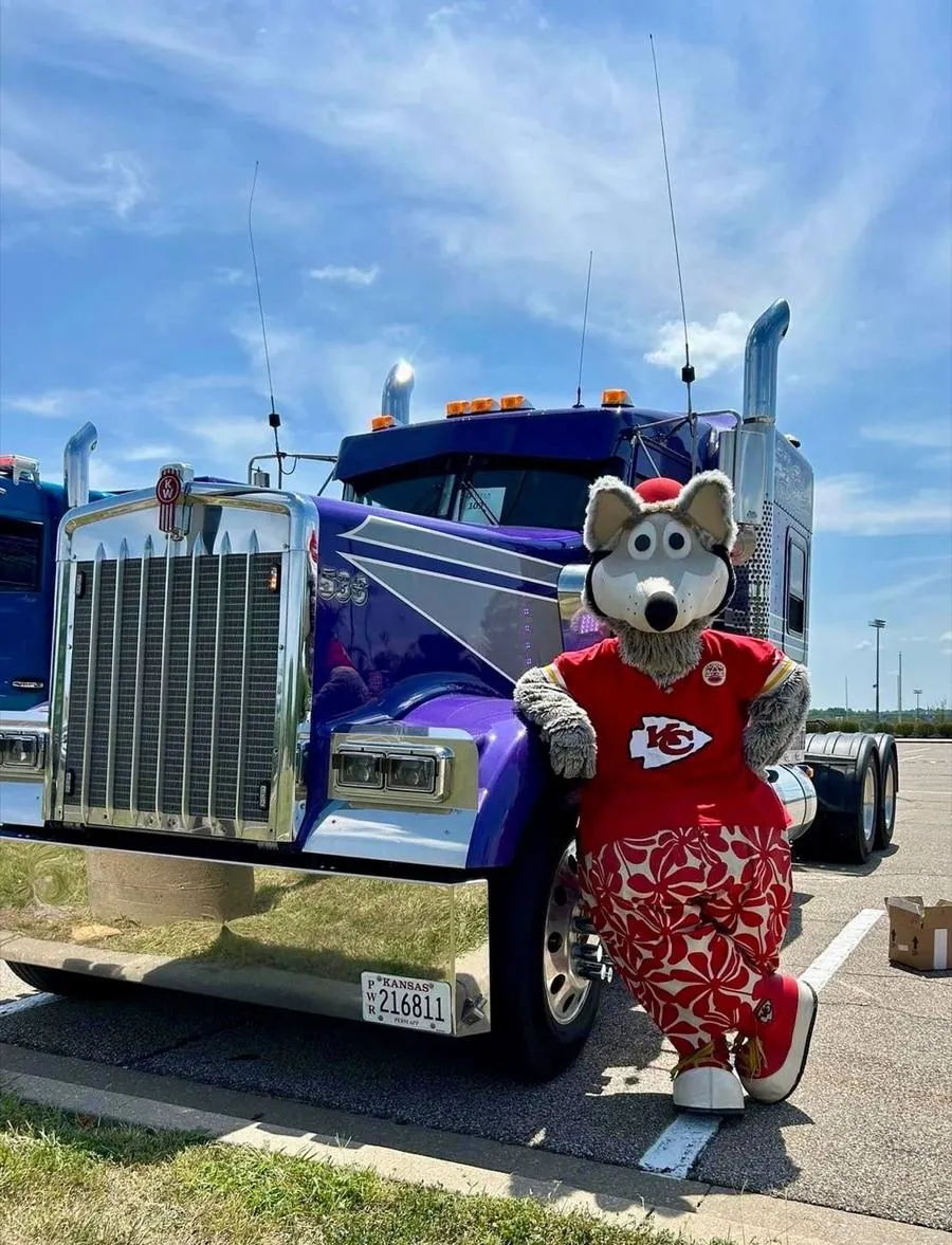 KC Wolf beside a show truck at Truckin' Back 2 School