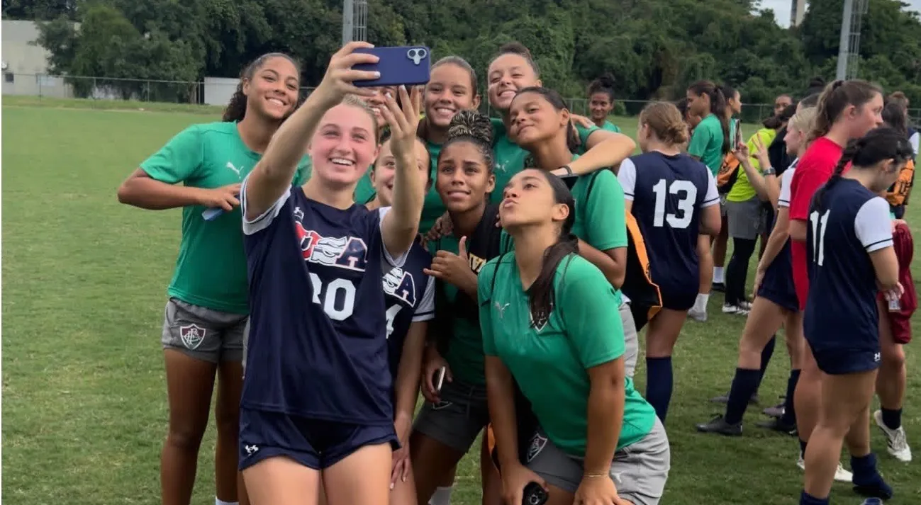 American and Brazilian players taking a selfie together after playing